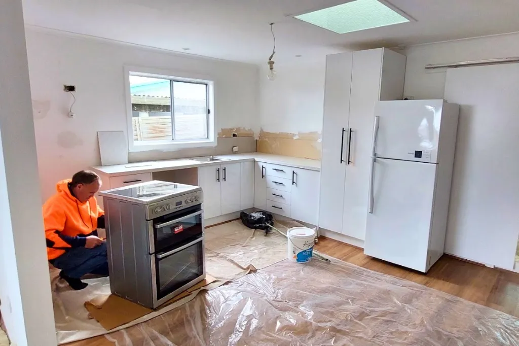 Ballarat tradesperson working on site installing kitchen appliances